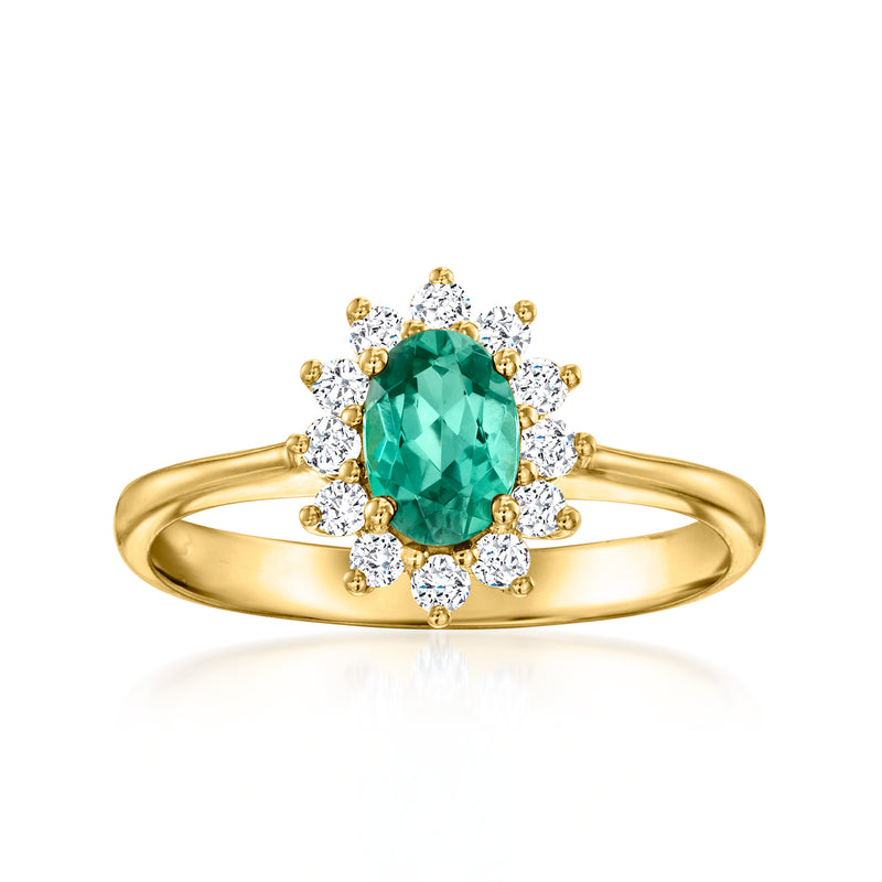 18kt yellow gold ring with green oval tourmaline center and round diamond halo