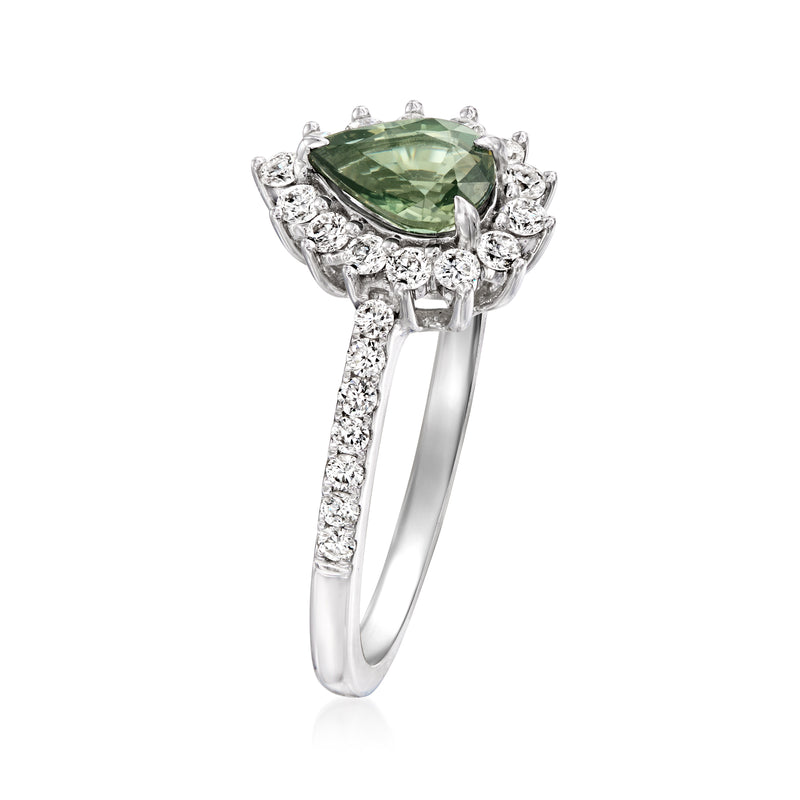 White gold ring with large green sapphire center, scalloped diamond halo