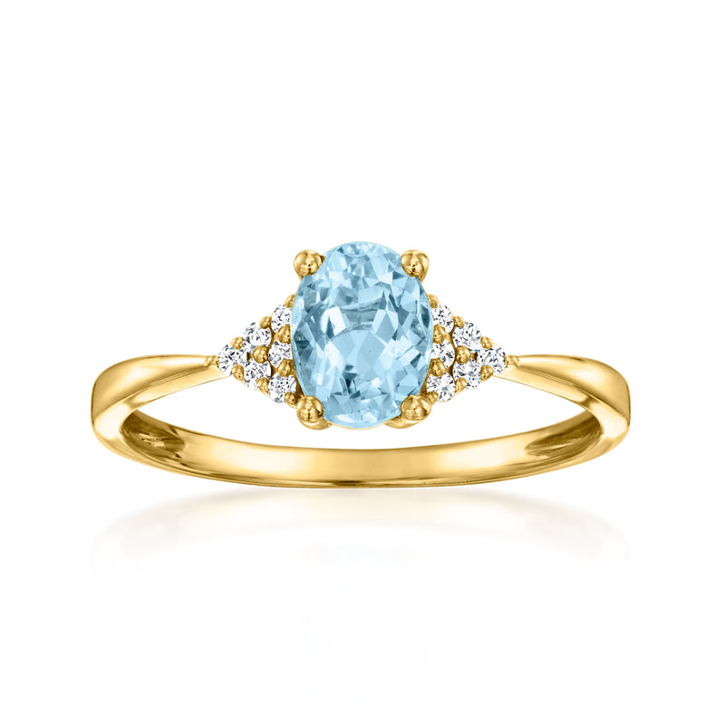 Aquamarine and diamond ring in 18kt yellow gold, oval center stone and side diamonds.