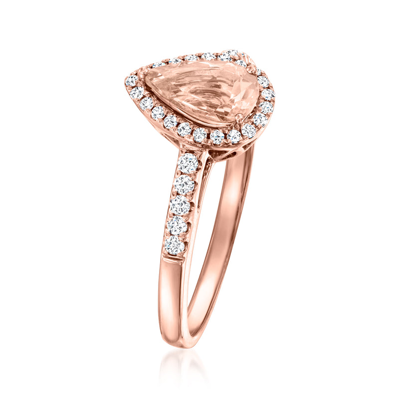 Morganite ring with pear-shaped center stone, diamond halo, and rose gold band