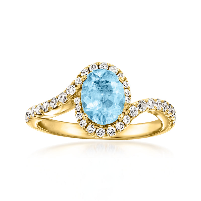 18kt yellow gold aquamarine swirl ring with round diamond halo