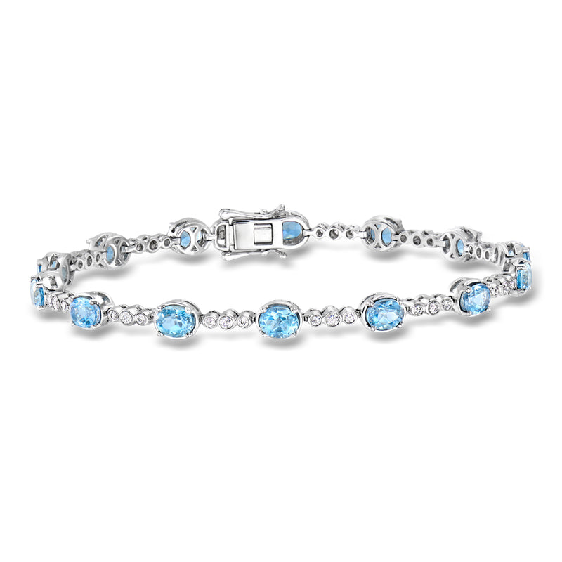 Aquamarine and diamond tennis bracelet in 18k white gold with blue round stones