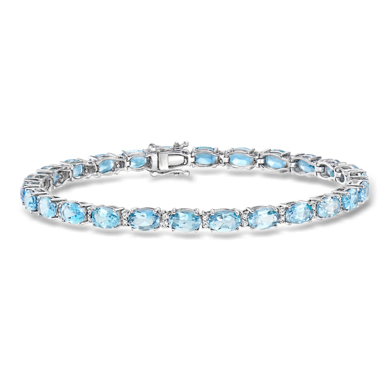 Aquamarine tennis bracelet in white gold with oval blue gemstones and diamond accents