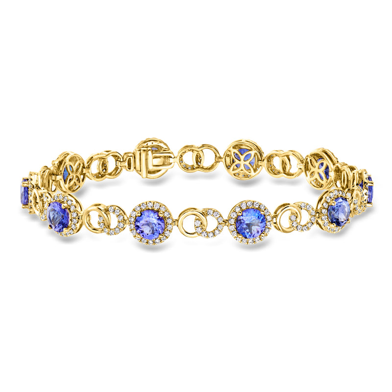 Yellow gold bracelet with blue round gemstones and diamond accents
