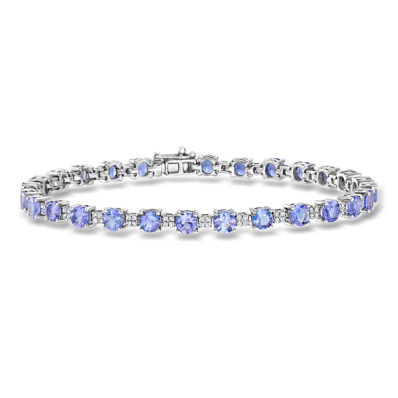 Tennis bracelet in white gold with oval blue tanzanite stones and small clear accents