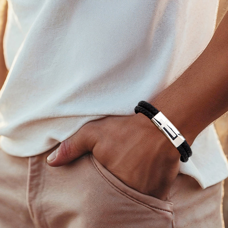 Men's black leather bracelet with stainless steel clasp on wrist
