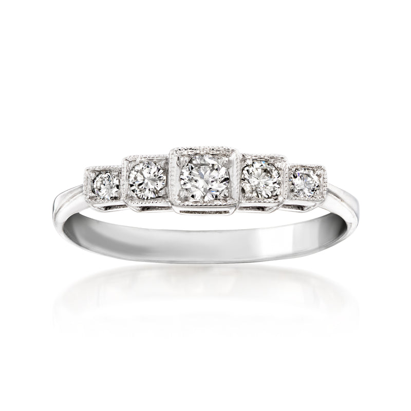 Vintage five-stone diamond ring in 18kt white gold with five framed stones, center larger
