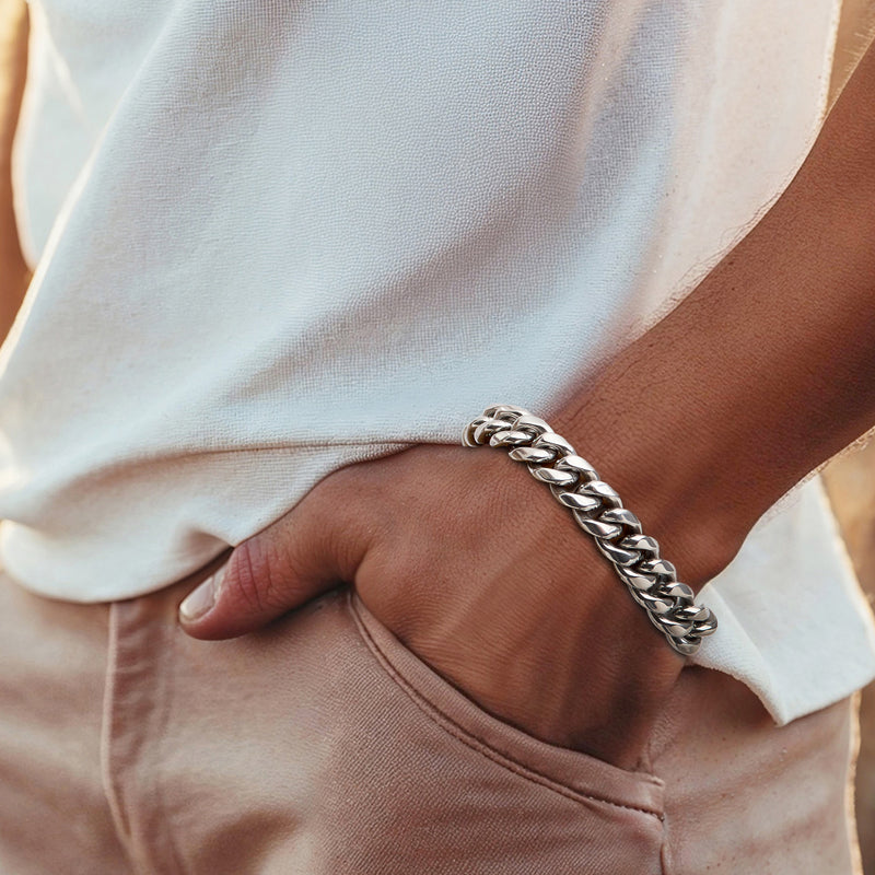 Cuban-link stainless steel bracelet worn on wrist, chunky polished links