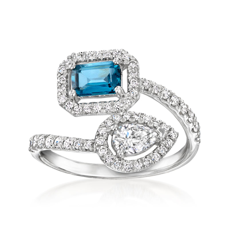 Sterling silver bypass ring with blue topaz center and diamond halo accents