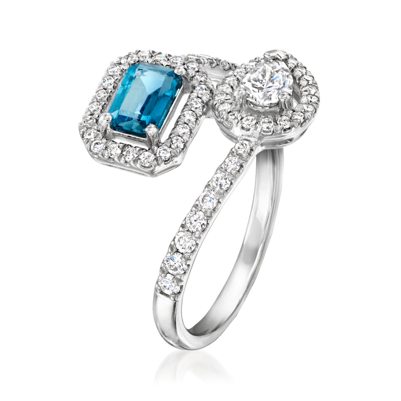 Sterling silver bypass ring with square blue topaz, round diamond halo, and pave band