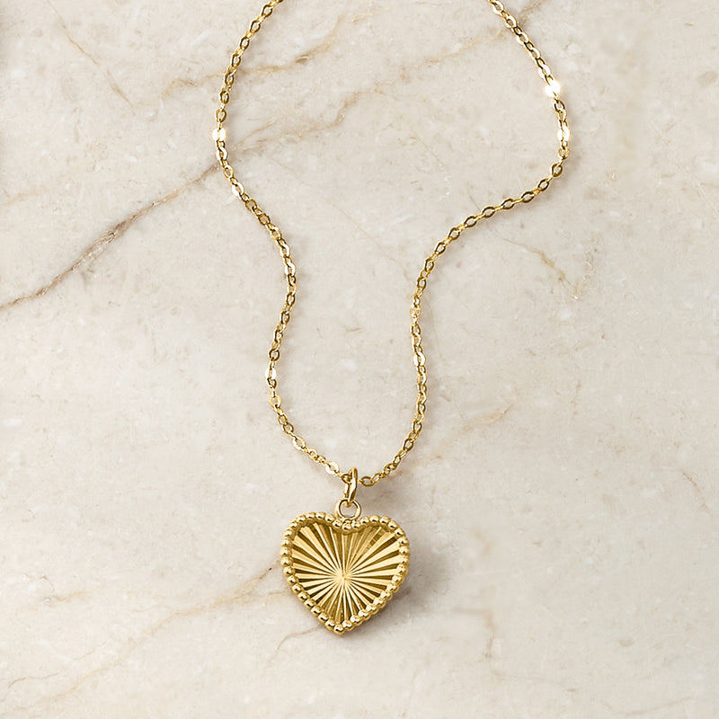 Yellow gold heart sunburst pendant necklace with linked chain, round sunburst detail