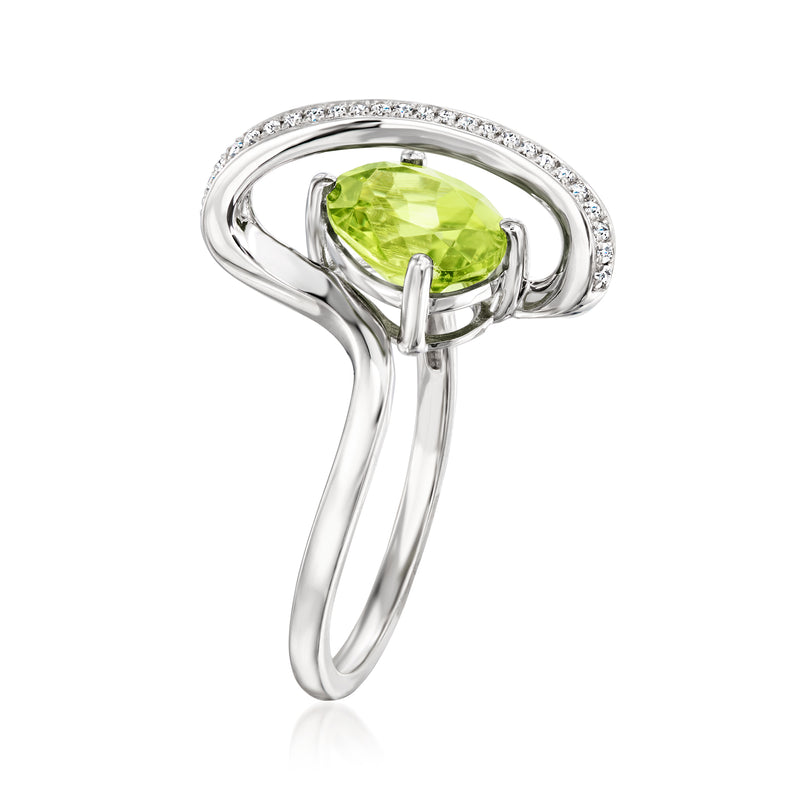 Sterling silver peridot ring with diamond halo and pear-cut green center stone