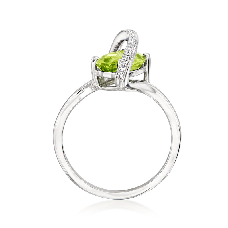 Sterling silver ring with oval peridot and diamond-accented bypass setting