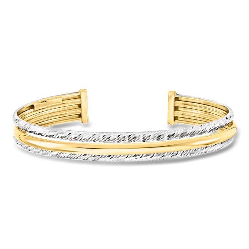 Two-tone sterling silver and gold cuff bracelet with open hinged textured bands