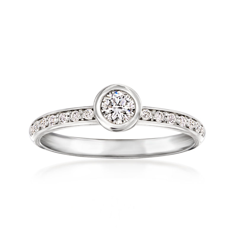 Vintage 14kt white gold diamond ring with round center stone and pave band
