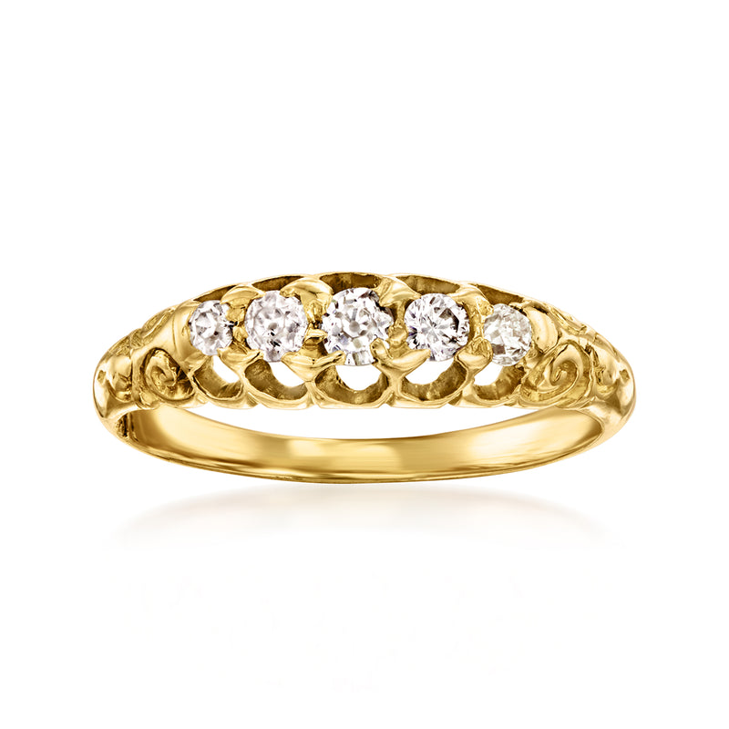 Vintage yellow gold diamond ring with five round-cut stones in scalloped setting