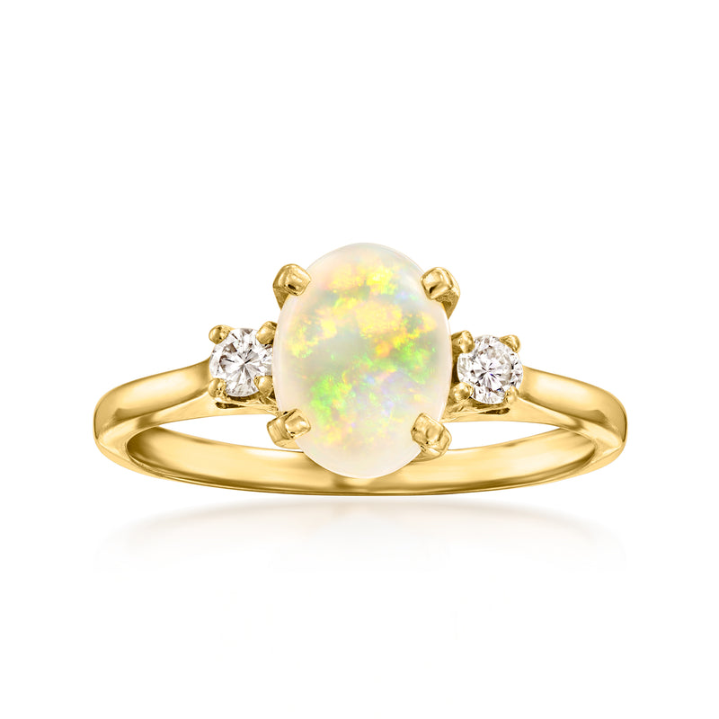 Vintage opal and diamond ring in 14kt yellow gold, oval opal with two round diamonds