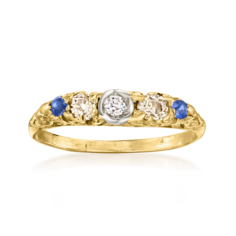 Vintage 18kt yellow gold ring with blue sapphire accents and round diamond center
