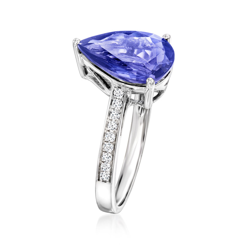 Teardrop blue gemstone ring with diamond side accents and 18kt white-gold prongs