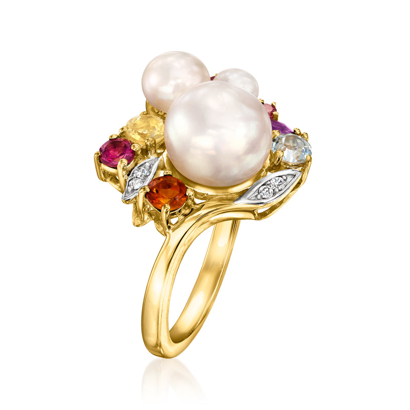 Gold-tone ring with three white pearls and multicolor gemstone side settings