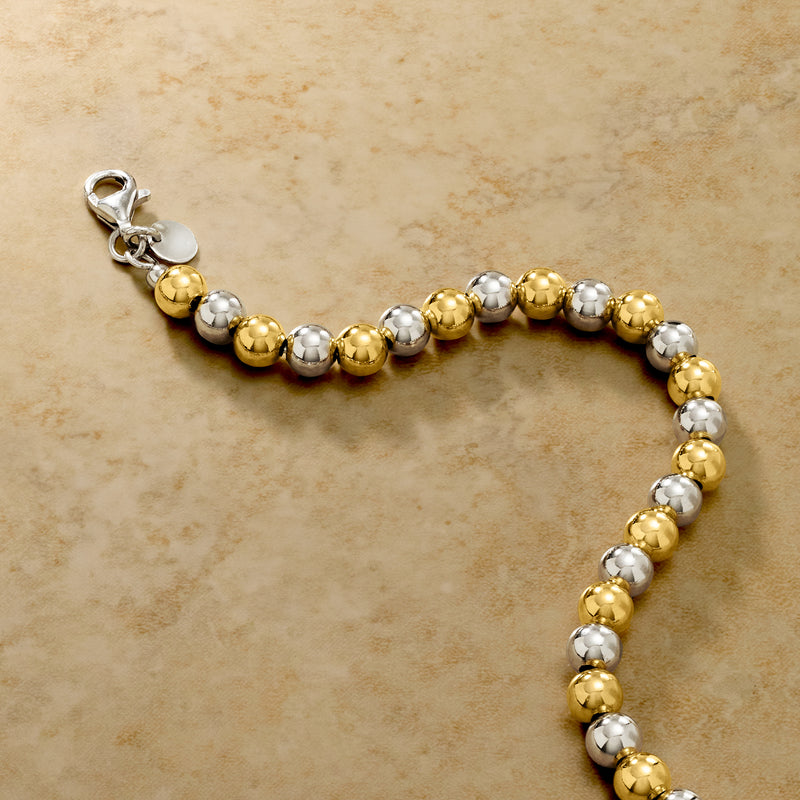 Gold-over-silver bead bracelet with round beads and side clasp for closure