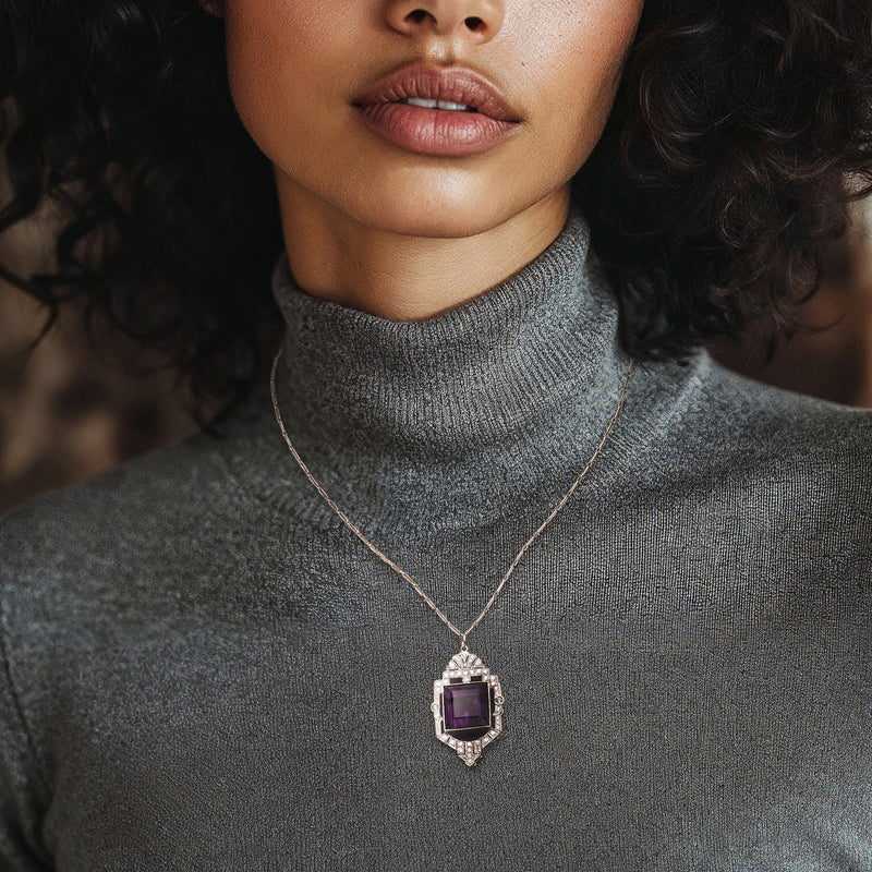 Amethyst and diamond pendant necklace on thin chain; rectangular amethyst in frame