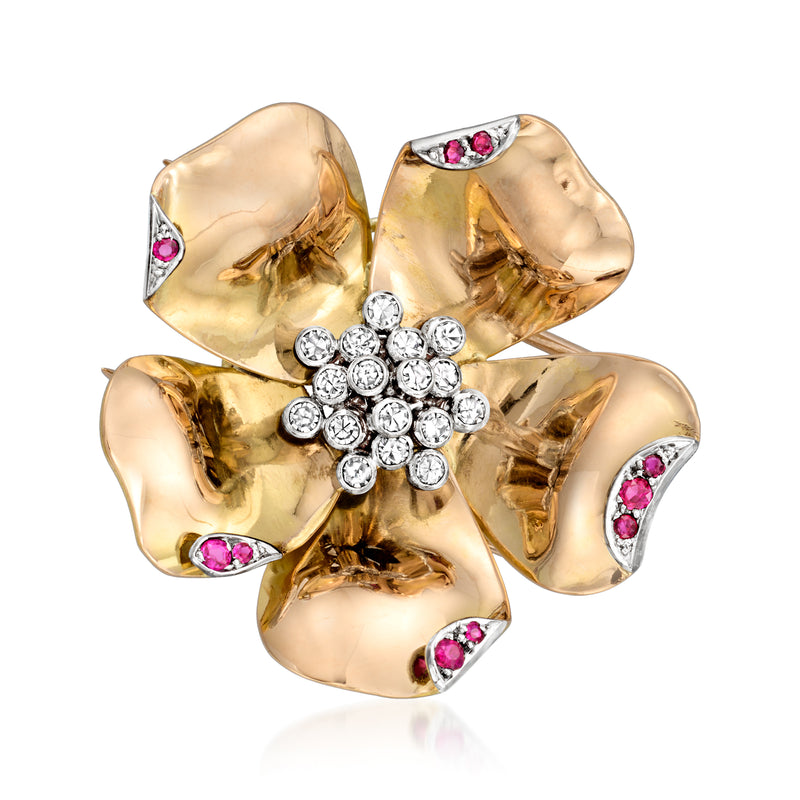 Vintage flower pin in yellow gold with diamond-like stones and pink ruby accents