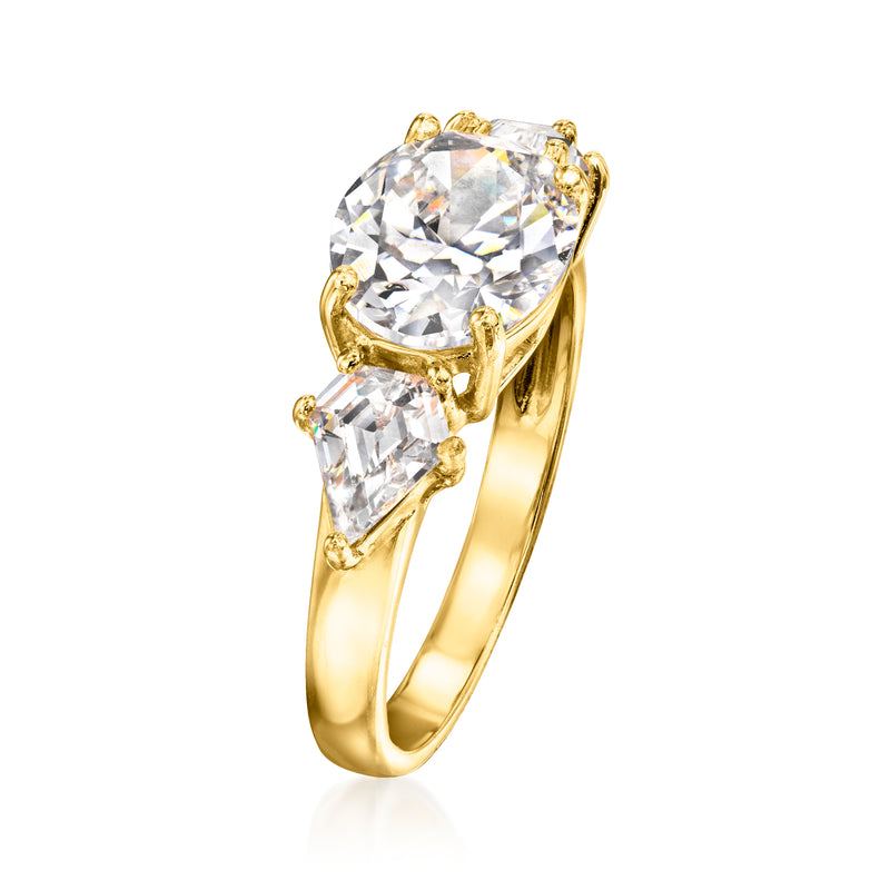 Three-stone CZ ring side view, large central stone with two flank stones, gold-tone