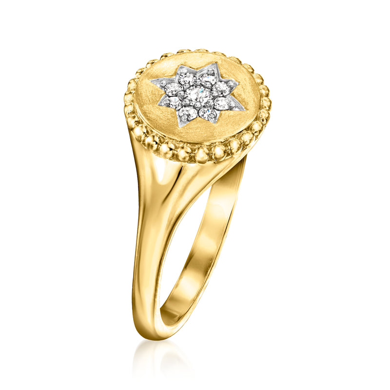 Gold star signet ring with oval face and diamond cluster halo border