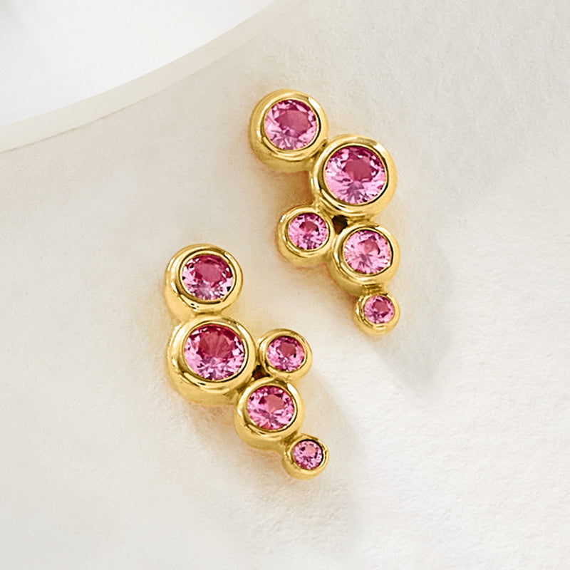 Gold-tone clustered bubble post earrings with round pink gemstones, side view