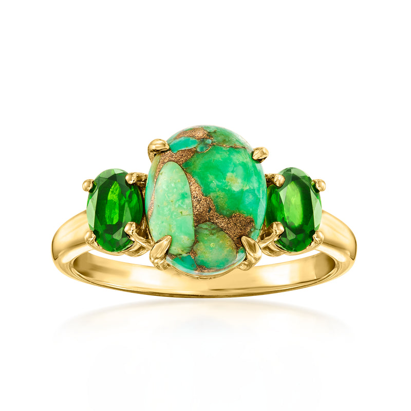 Gold-tone ring with oval turquoise cabochon and three green stone accents