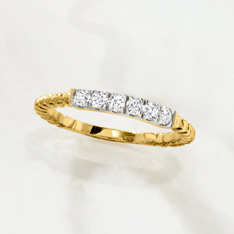 Gold diamond beaded ring with bar of round diamonds and braided edge