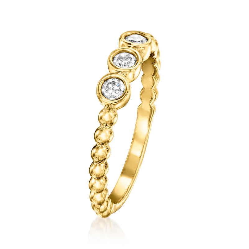 Gold three-stone bezel diamond ring with beaded scalloped shank