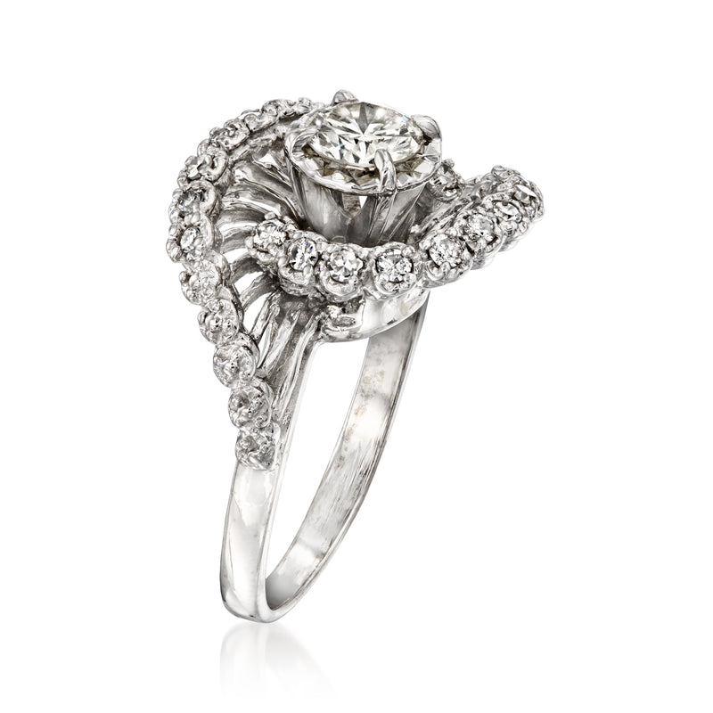 Vintage diamond swirl ring in 14kt white gold with central round diamond