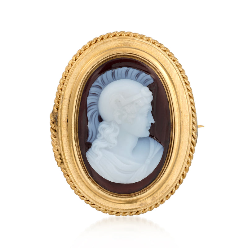 Oval yellow gold cameo pin with white profile on dark agate background