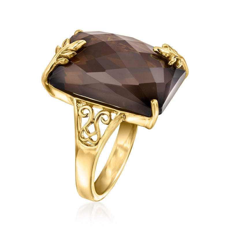 Gold ring with faceted smoky quartz center stone and leafy corner accents