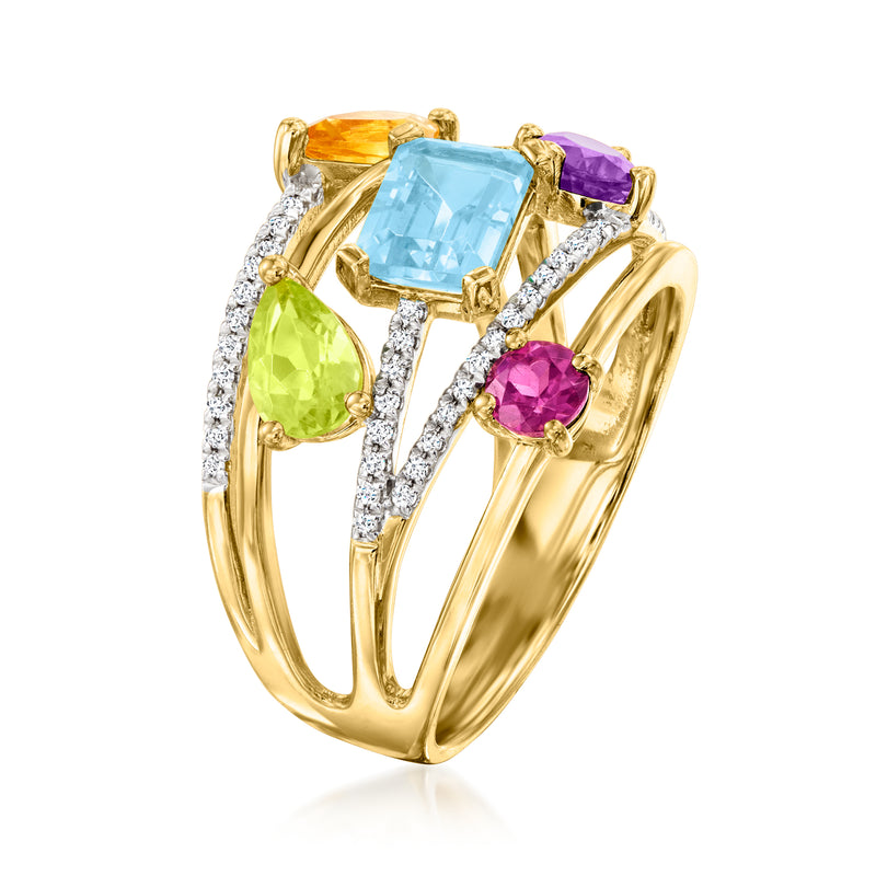 Gold multi-gem fashion ring with large blue square stone, green teardrop, purple round, diamonds