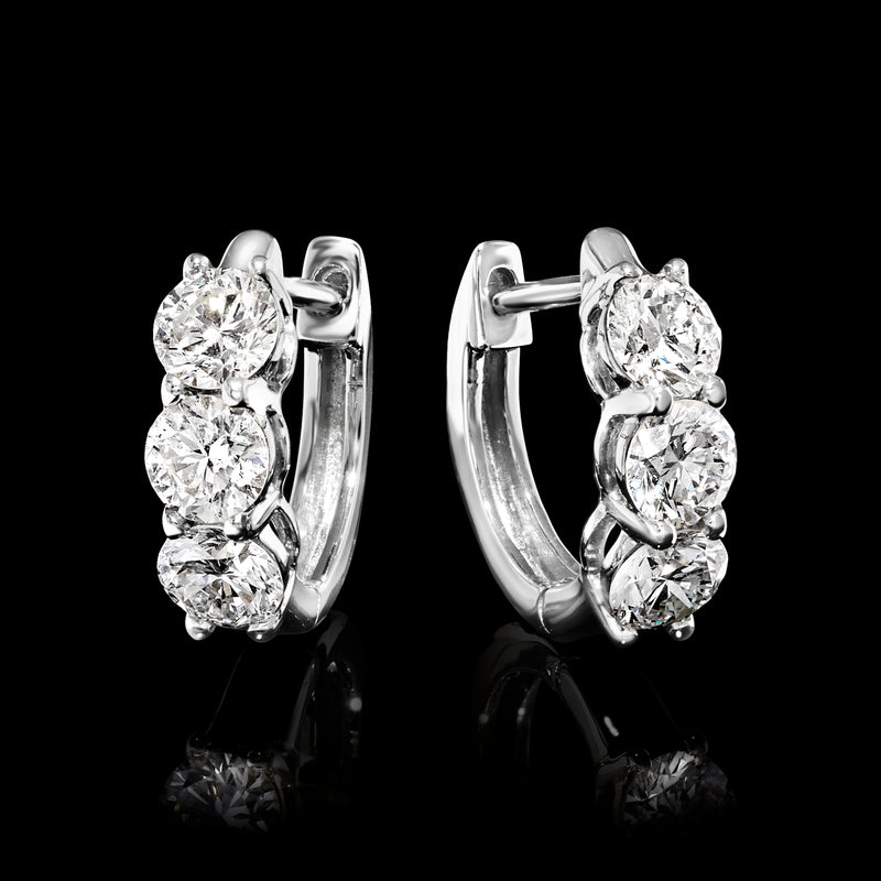 Three-stone huggie hoop earrings in 14kt white gold with round diamonds