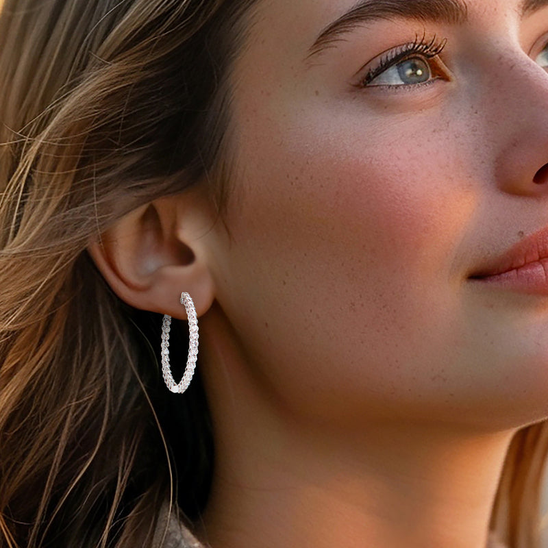Lab-grown diamond hoop earring in white gold, worn on ear