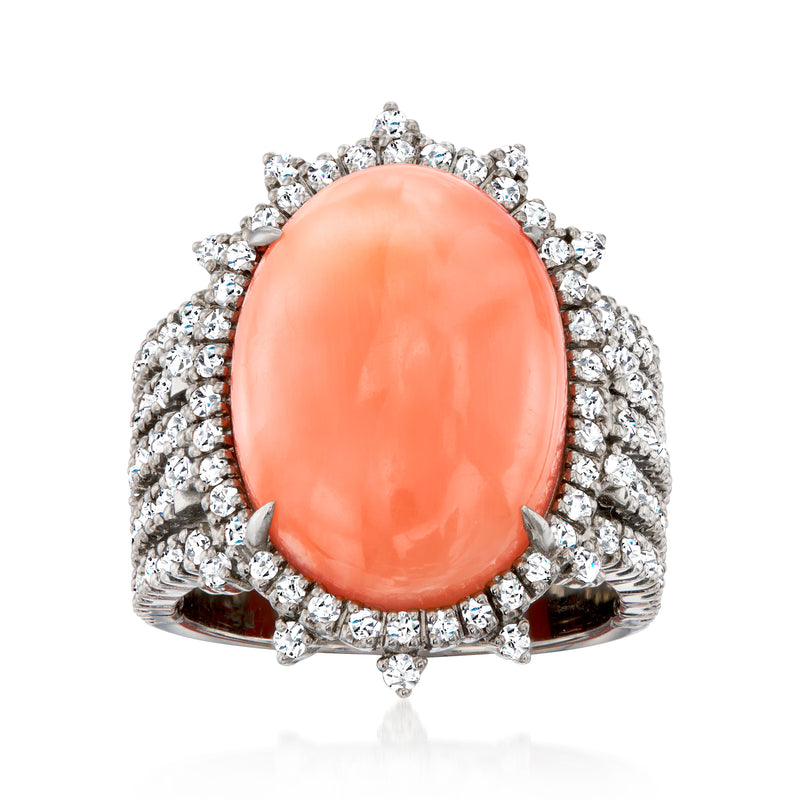 Coral oval gemstone ring with diamond halo and white gold band, vintage style