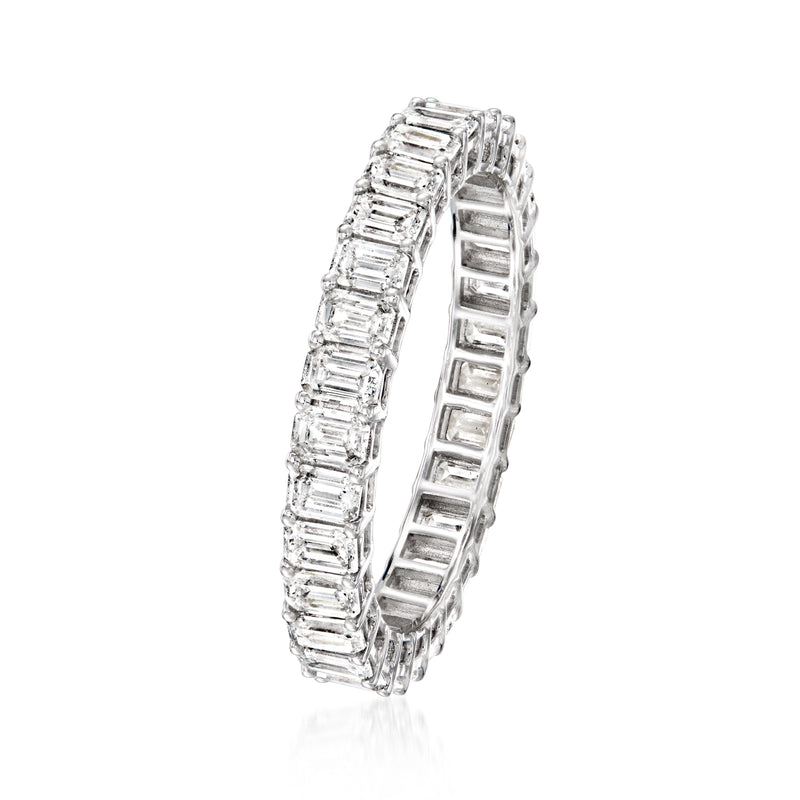 White gold eternity band side view with emerald-cut diamond channel settings.