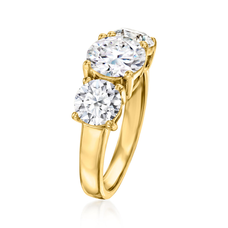 Three-stone lab-grown diamond ring in 14k yellow gold, side view of round center and side stones