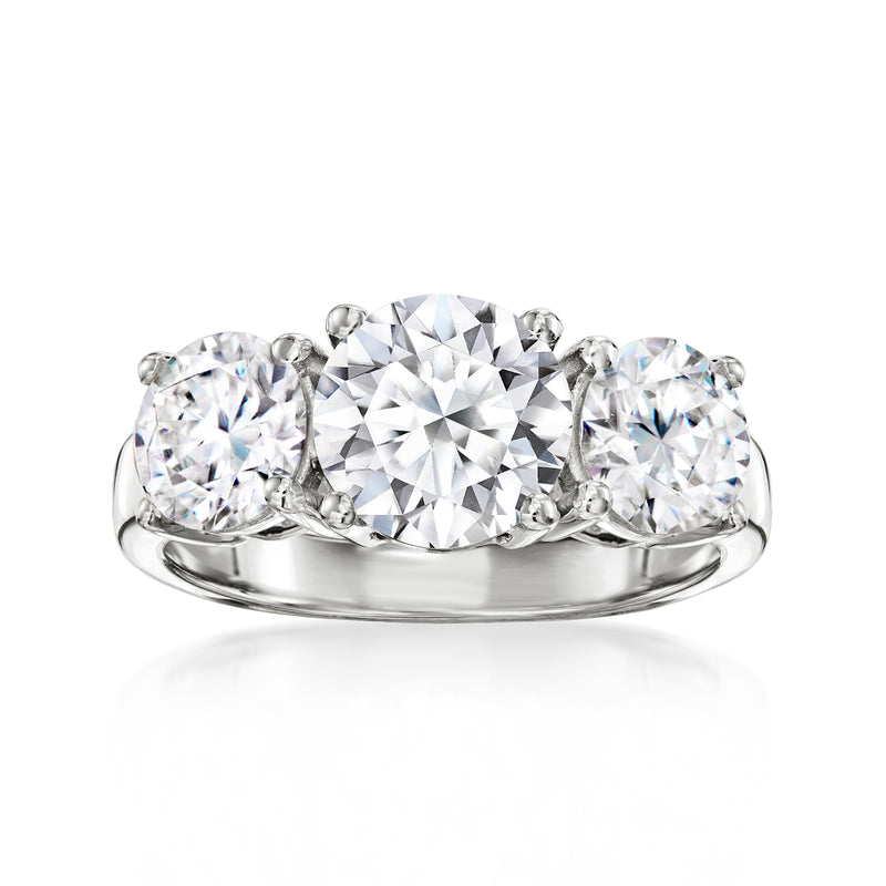 Three-stone lab-grown diamond ring in white gold, round center with two side diamonds