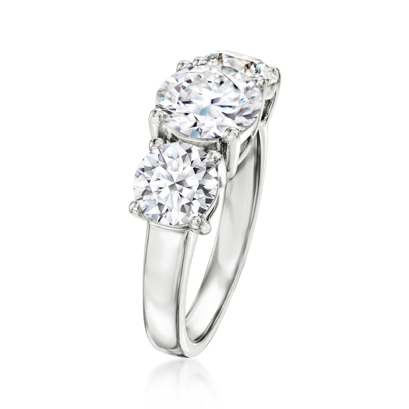 Three-stone lab-grown diamond ring, prong-set round center with side stones, white gold band
