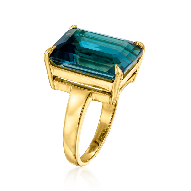 Gold over sterling ring with blue topaz emerald-cut style center, corner prongs