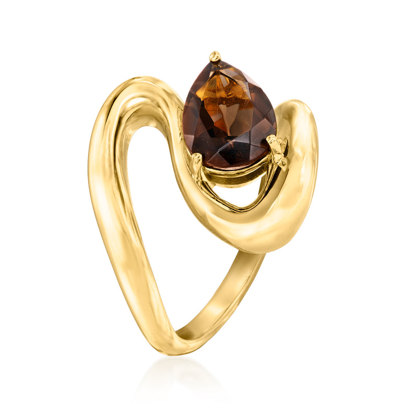 Gold swirl band ring featuring an oval smoky quartz stone and small gold prongs