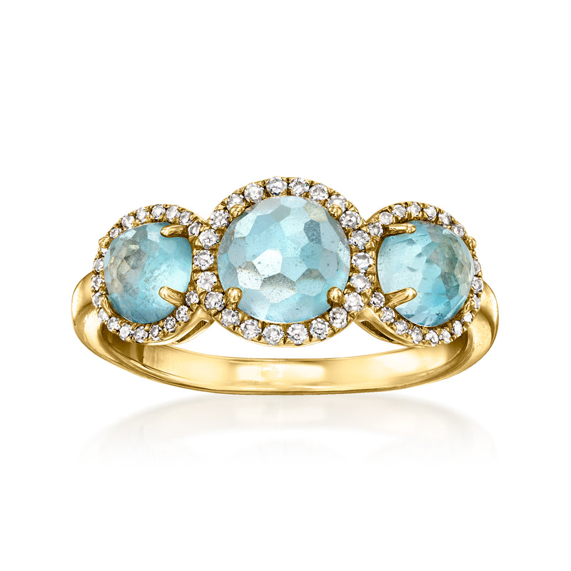Three-stone sky blue topaz ring with diamond halos, oval stones, 10kt yellow gold
