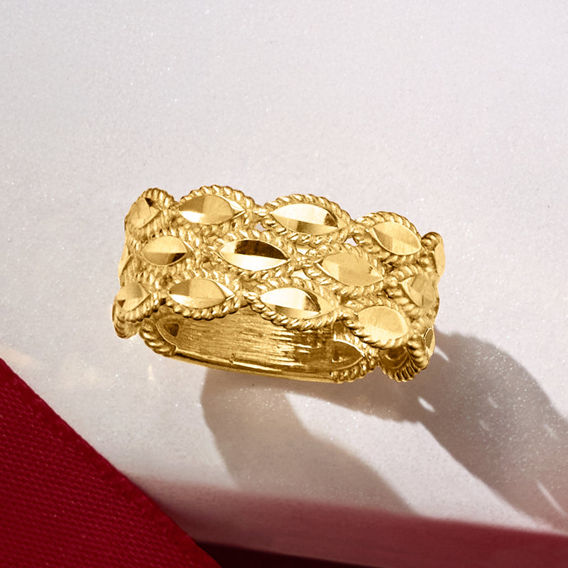 Wide gold roped ring with oval textured links and scalloped rope edges