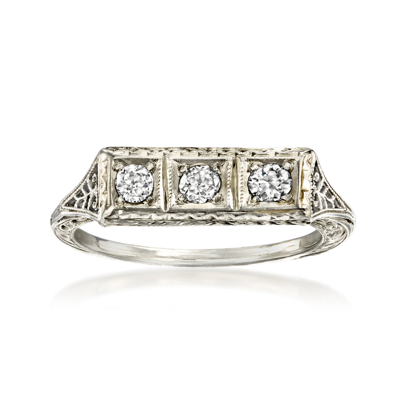 Three-stone diamond ring in white gold with rectangular bezel settings