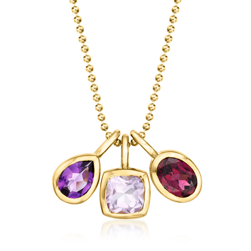 Gold pendant necklace with three gemstones: amethyst, rhodolite, and pink stone